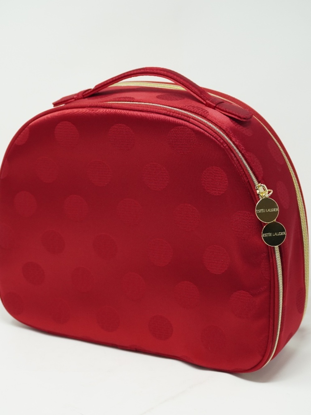 Estee Lauder makeup train case featuring a polka dot pattern